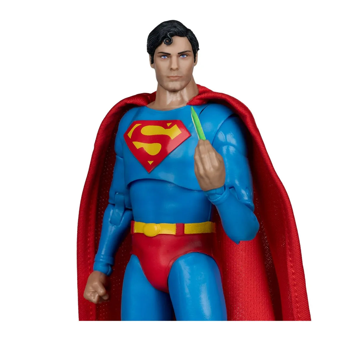 Superman action figure with red cape and blue suit on a white background