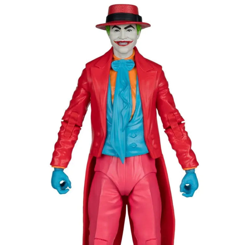 Action figure of a character in a red suit with a blue shirt and hat on a white background