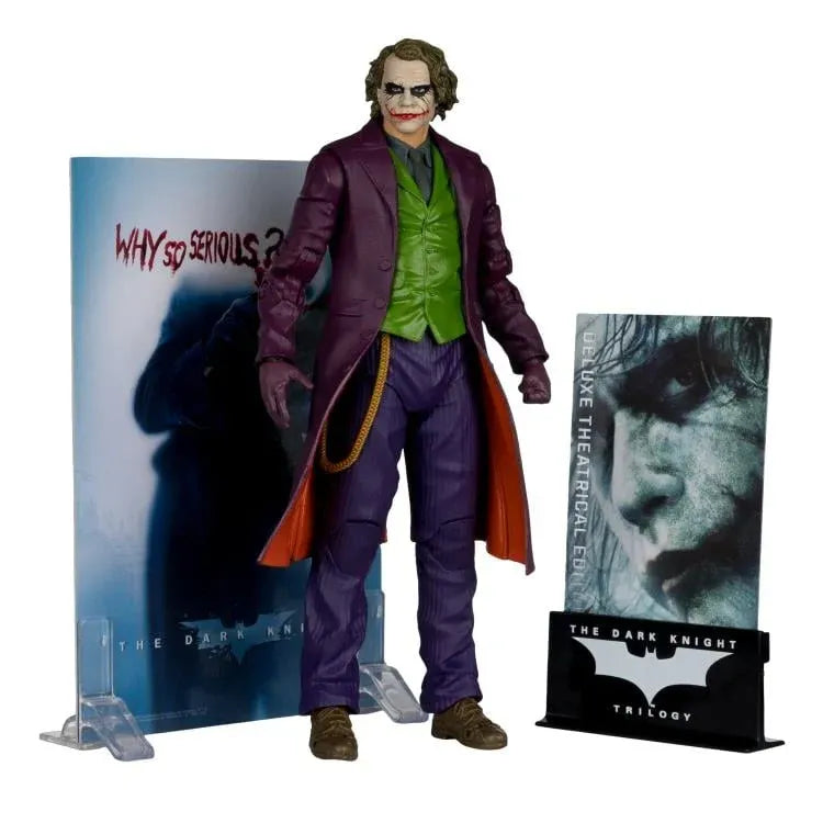 Action figure of a character in a purple suit with movie posters in the background