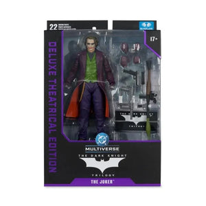 Action figure packaging of The Joker from 'The Dark Knight' trilogy with detailed accessories.