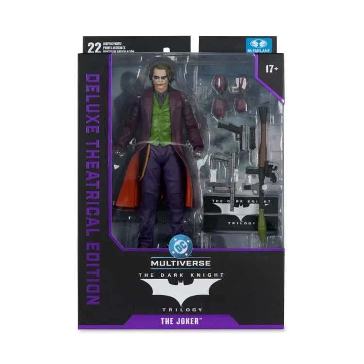 Action figure packaging of The Joker from 'The Dark Knight' trilogy with detailed accessories.